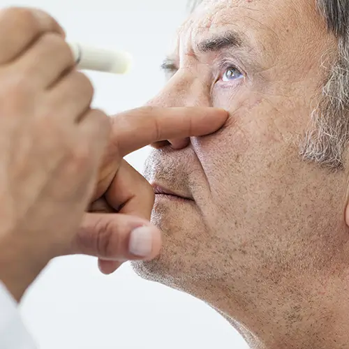 elderly man being looked at by eye doctor for glaucoma
