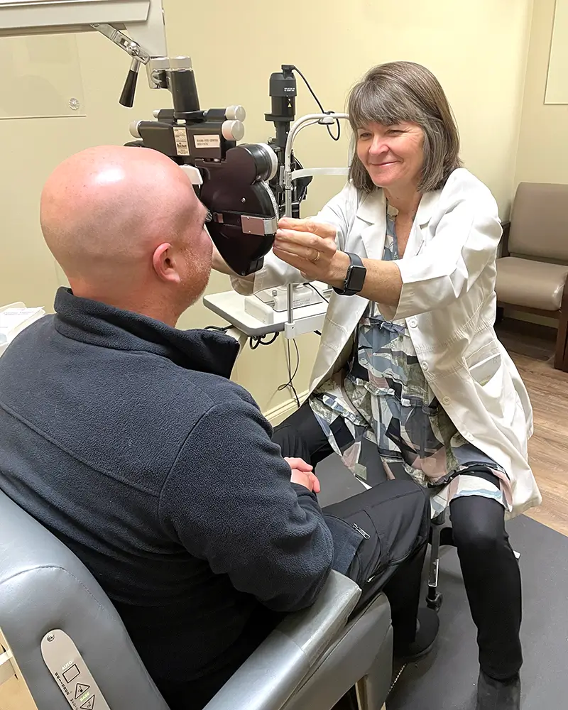 Silvia Mende, OD, giving a patient an eye exam