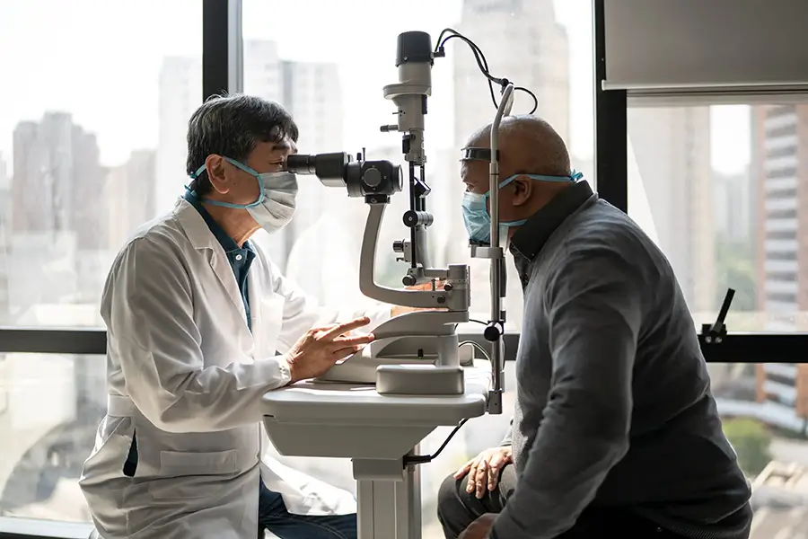 Optometrists giving a patient an eye exam